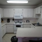 u-shaped-kitchen-white-cabinets-countertop-and-cabinets