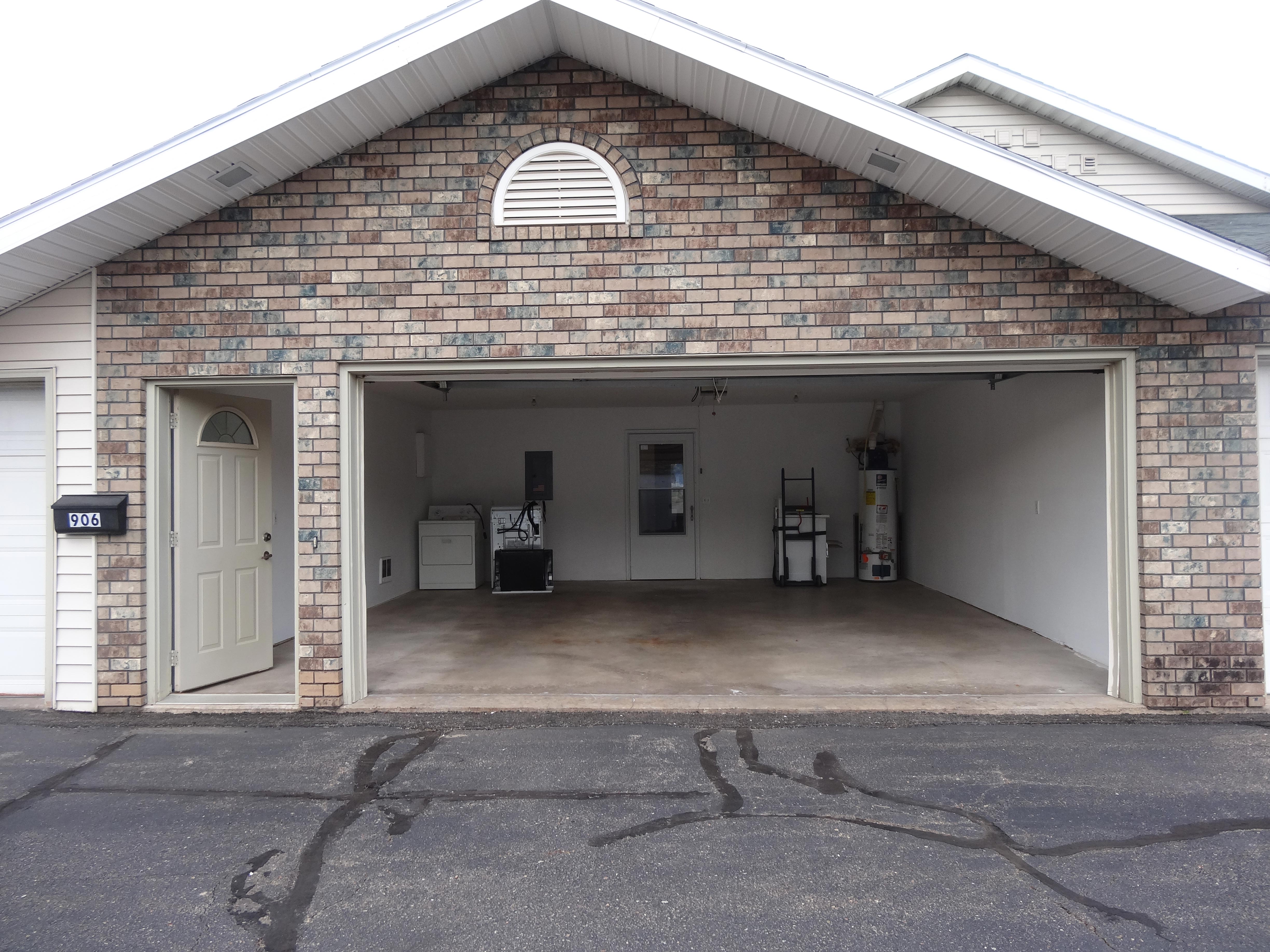 side-door-garage-door-open-to-show-garage-space