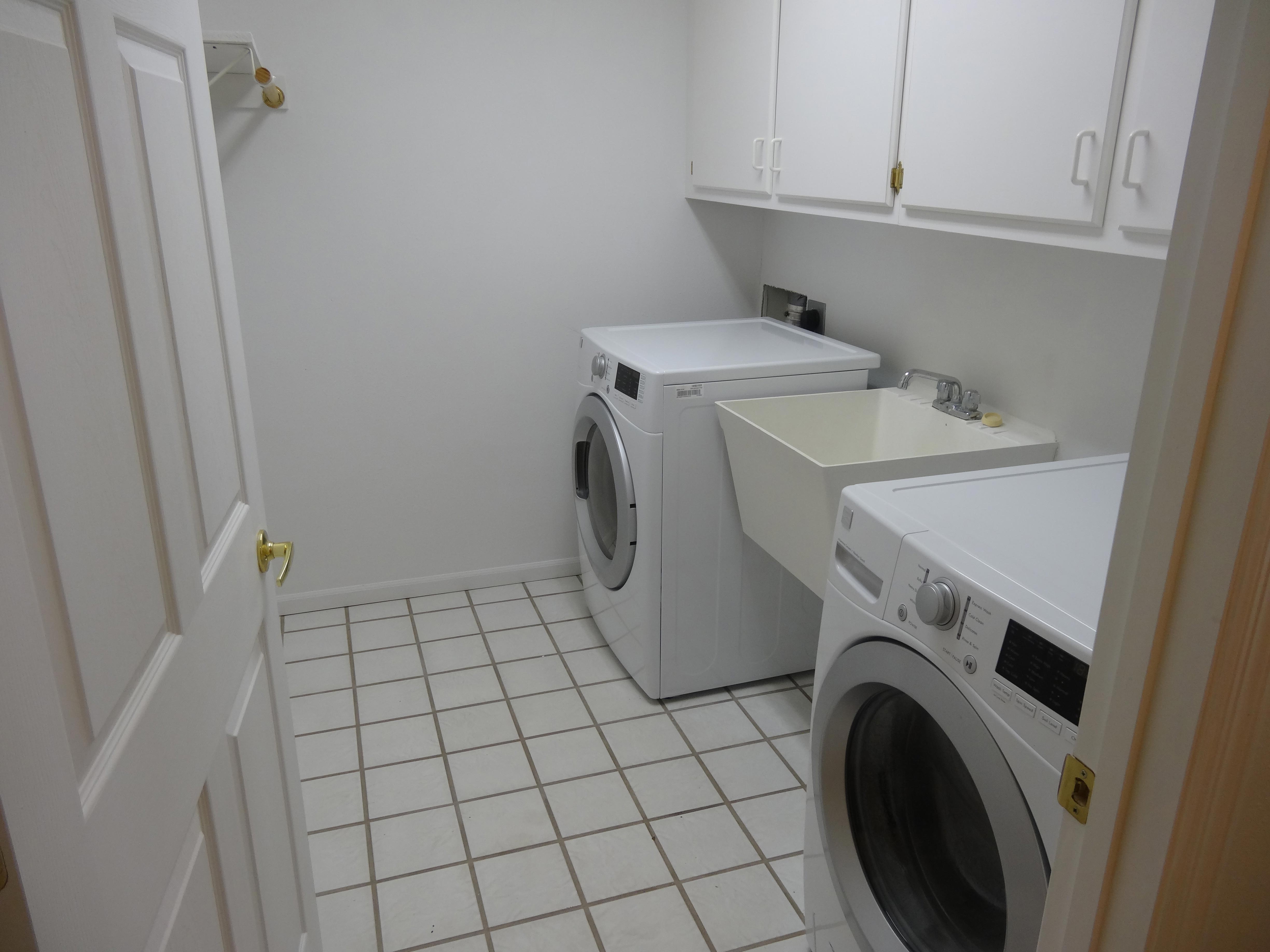 white-tile-white-washer-dryer-utility-sink