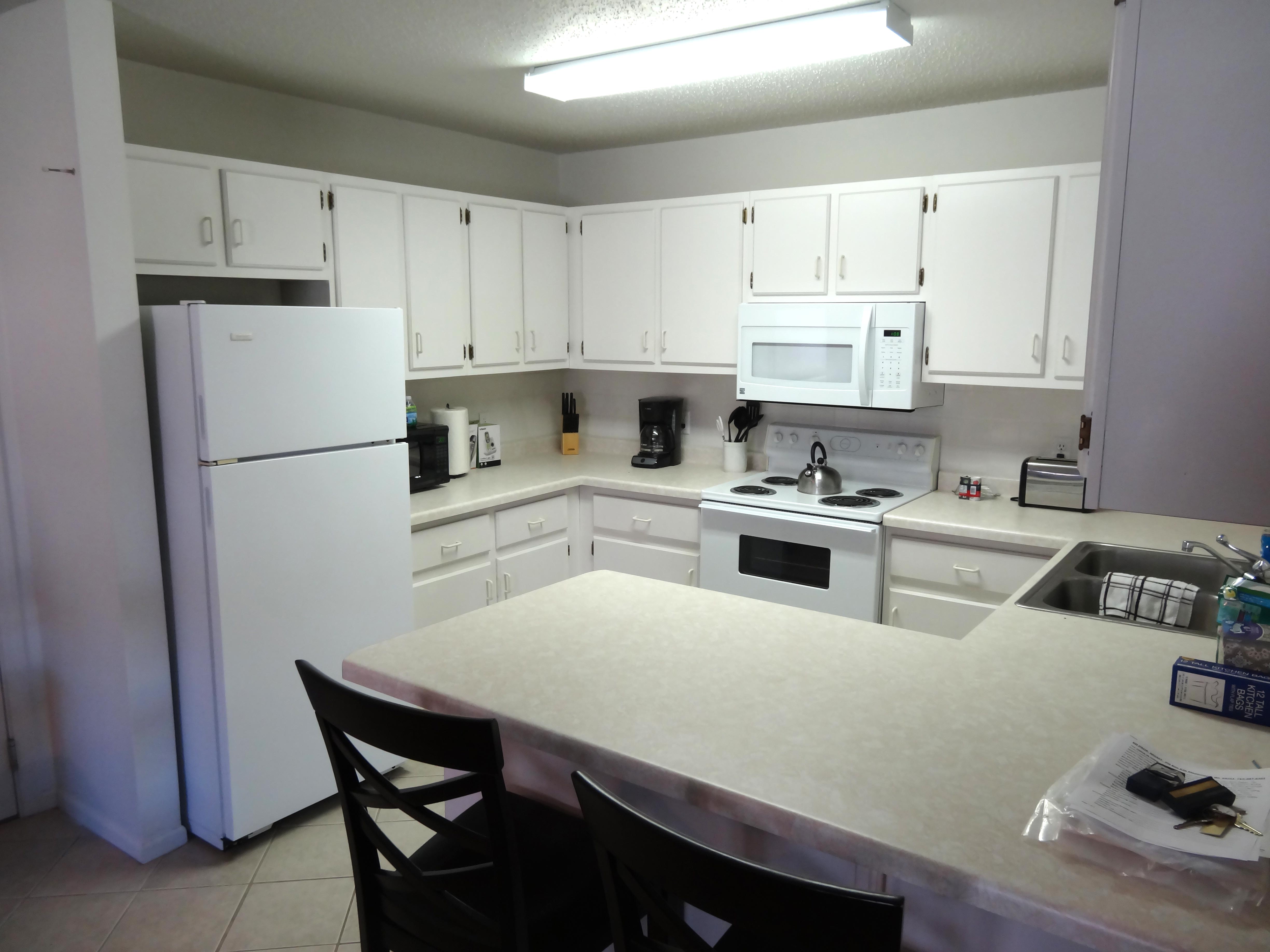 white-kitchen-fridge-stove-cabinets